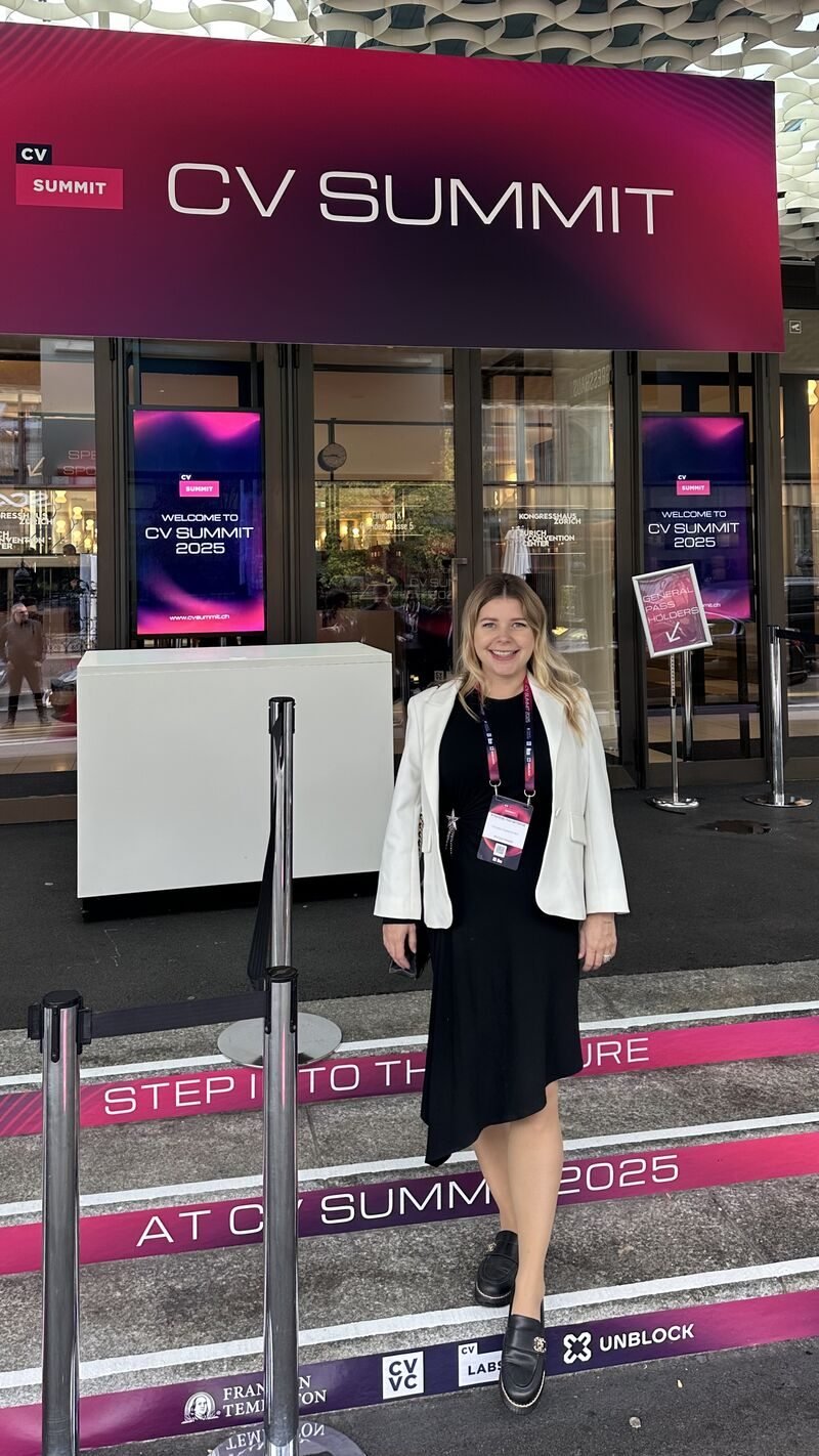 Marina Abramova at CV Summit 2025 in Zurich, standing beneath the event entrance sign